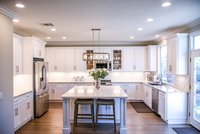 large bright white kitchen with an island 